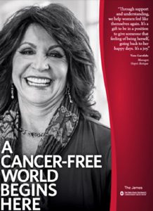 Smiling woman on a cancer-awareness poster with the slogan 'A cancer-free world begins here' and a red quote panel. | Jerad Schutt | Nashville Marketing Consultant | Fractional CMO | Jerad Schutt | Nashville Marketing Consultant | Fractional CMO